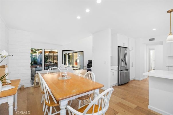 Dining room, Interior, Kitchen, Pendant Lights, Recessed Lighting, Stainless Steel Appliances, Wood Texture Flooring