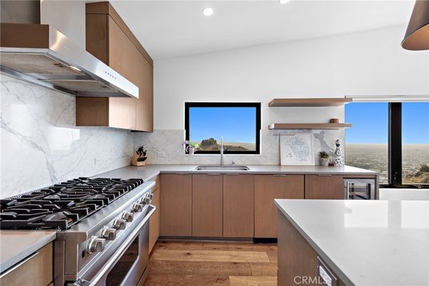 Interior, Kitchen, Marble Walls, Recessed Lighting, Stainless Steel Appliances, Wood Texture Flooring