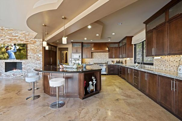 Fireplace, Interior, Kitchen, Pendant Lights, Recessed Lighting, Stainless Steel Appliances, Stone Walls