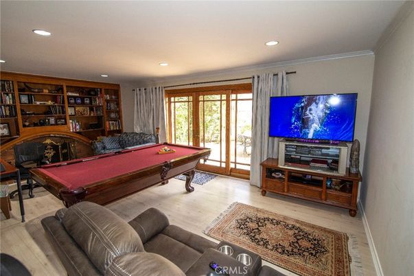 Billiard Table, Fireplace, Game Room, Interior, Living room, Recessed Lighting, Wood Texture Flooring