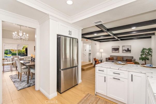 Chandelier, Dining room, Interior, Kitchen, Recessed Lighting, Stainless Steel Appliances, Wood Texture Flooring