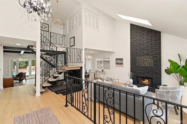 Chandelier, Dining room, Fireplace, Interior, Living room, Recessed Lighting, Wood Texture Flooring