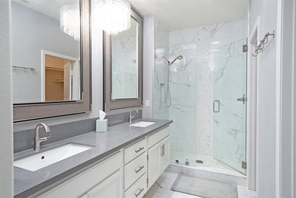 Bathroom, Dual Sink Vanities, Glass Shower, Interior, Marble, Marble Walls, Recessed Lighting