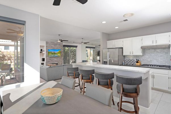 Fireplace, Interior, Kitchen, Living room, Recessed Lighting, Stainless Steel Appliances, Stone Walls