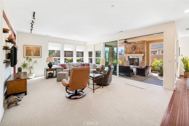 Fireplace, Interior, Living room, Recessed Lighting, Stone Walls, Wood Texture Flooring