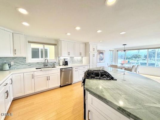 Dining room, Interior, Kitchen, Pendant Lights, Recessed Lighting, Stainless Steel Appliances, Wood Texture Flooring
