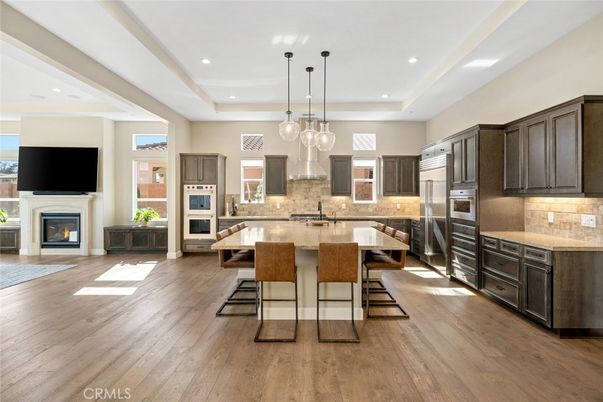 Fireplace, Interior, Kitchen, Pendant Lights, Recessed Lighting, Stainless Steel Appliances, Wood Texture Flooring