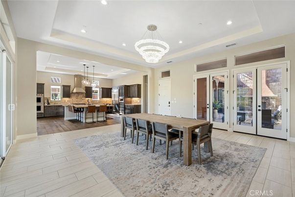 Chandelier, Dining room, Interior, Kitchen, Pendant Lights, Recessed Lighting, Stainless Steel Appliances, Wood Texture Flooring