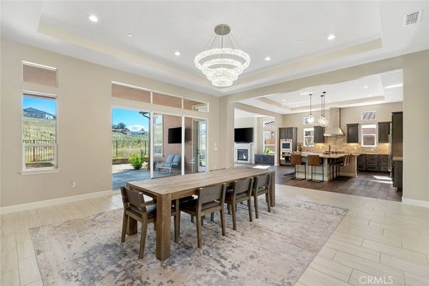 Chandelier, Dining room, Interior, Kitchen, Pendant Lights, Recessed Lighting, Stainless Steel Appliances, Wood Texture Flooring