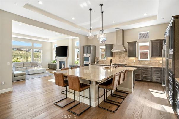 Dining room, Fireplace, Interior, Kitchen, Living room, Pendant Lights, Recessed Lighting, Stainless Steel Appliances, Wood Texture Flooring