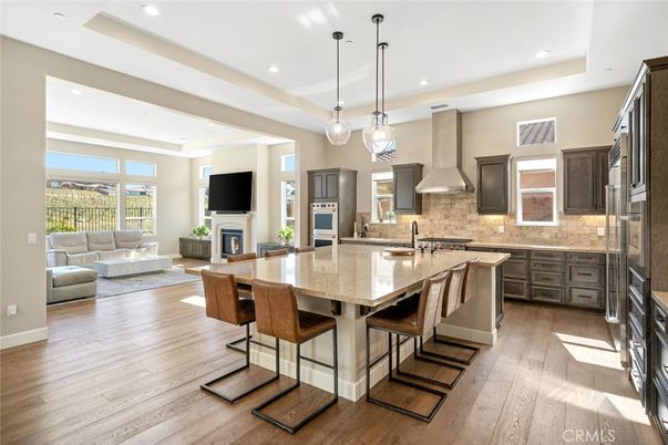 Dining room, Fireplace, Interior, Kitchen, Living room, Pendant Lights, Recessed Lighting, Stainless Steel Appliances, Wood Texture Flooring