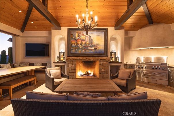 Chandelier, Fireplace, Interior, Living room, Recessed Lighting, Stainless Steel Appliances, Wooden Beams, Wooden Ceilings