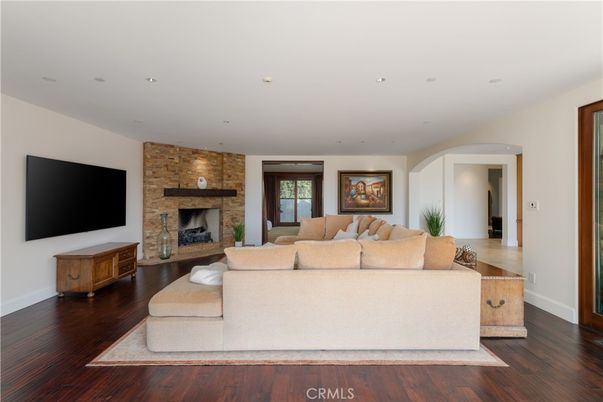 Fireplace, Interior, Living room, Recessed Lighting, Stone Walls, Wood Texture Flooring