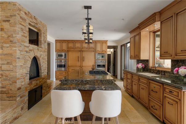 Fireplace, Interior, Kitchen, Pendant Lights, Recessed Lighting, Stainless Steel Appliances, Stone Walls
