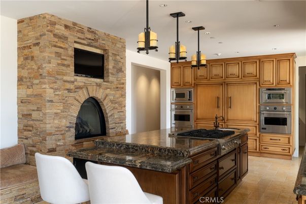 Interior, Kitchen, Pendant Lights, Recessed Lighting, Stainless Steel Appliances, Stone Walls