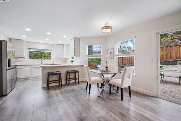Dining room, Interior, Kitchen, Recessed Lighting, Stainless Steel Appliances, Wood Texture Flooring