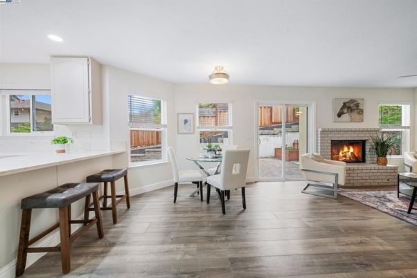 Dining room, Fireplace, Interior, Living room, Recessed Lighting, Wood Texture Flooring