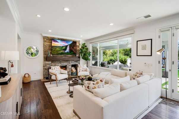Fireplace, Interior, Living room, Recessed Lighting, Stone Walls, Wood Texture Flooring