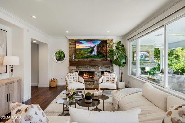 Fireplace, Interior, Living room, Recessed Lighting, Stone Walls, Wood Texture Flooring