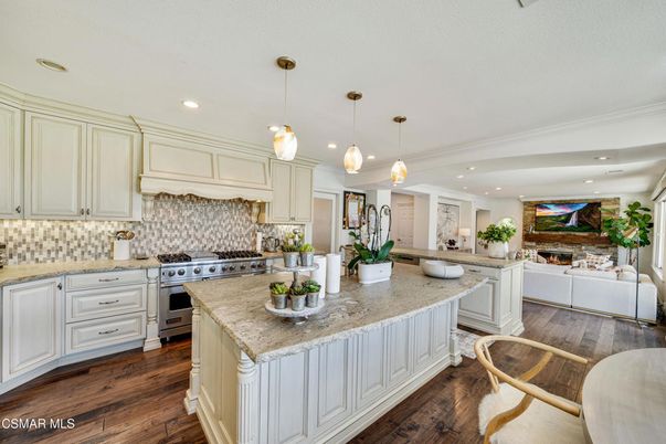 Fireplace, Interior, Kitchen, Living room, Pendant Lights, Recessed Lighting, Stainless Steel Appliances, Wood Texture Flooring