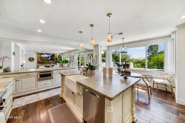 Dining room, Interior, Kitchen, Pendant Lights, Recessed Lighting, Stainless Steel Appliances, Wood Texture Flooring