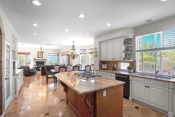 Chandelier, Dining room, Fireplace, Interior, Kitchen, Living room, Recessed Lighting, Stainless Steel Appliances