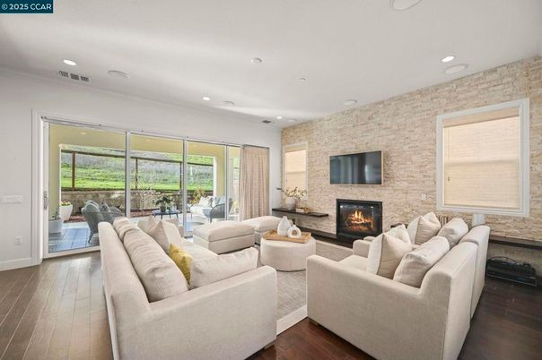 Fireplace, Interior, Living room, Recessed Lighting, Stone Walls, Wood Texture Flooring
