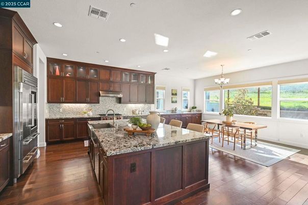 Chandelier, Dining room, Interior, Kitchen, Recessed Lighting, Stainless Steel Appliances, Wood Texture Flooring