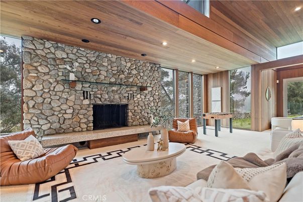 Fireplace, Game Room, Interior, Living room, Recessed Lighting, Stone Walls, Wooden Ceilings