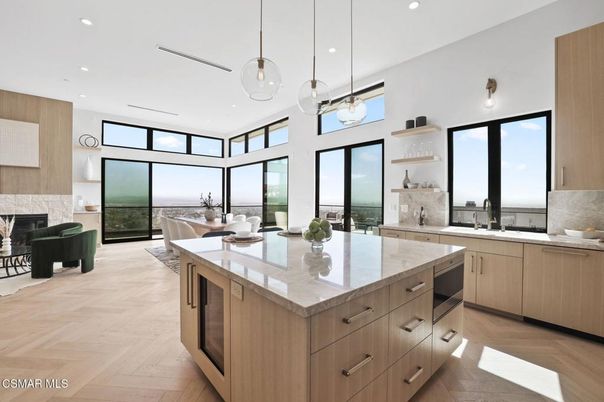 Dining room, Fireplace, Interior, Kitchen, Living room, Pendant Lights, Recessed Lighting, Water, Wood Texture Flooring