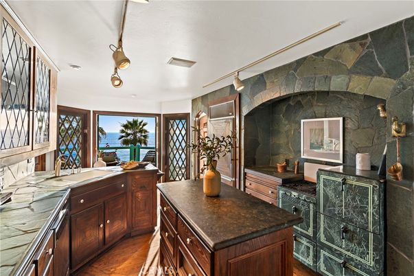 Interior, Kitchen, Stone Walls, Tile Countertops, Water, Wood Texture Flooring