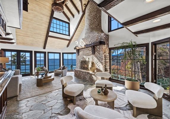 Fireplace, Interior, Living room, Recessed Lighting, Water, Wooden Beams