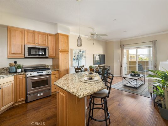 Dining room, Interior, Kitchen, Pendant Lights, Recessed Lighting, Stainless Steel Appliances, Wood Texture Flooring
