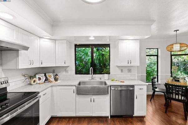 Dining room, Interior, Kitchen, Pendant Lights, Recessed Lighting, Stainless Steel Appliances, Wood Texture Flooring