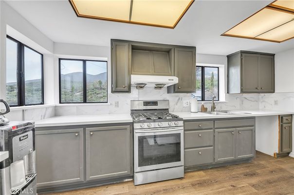Interior, Kitchen, Marble Walls, Stainless Steel Appliances, Wood Texture Flooring