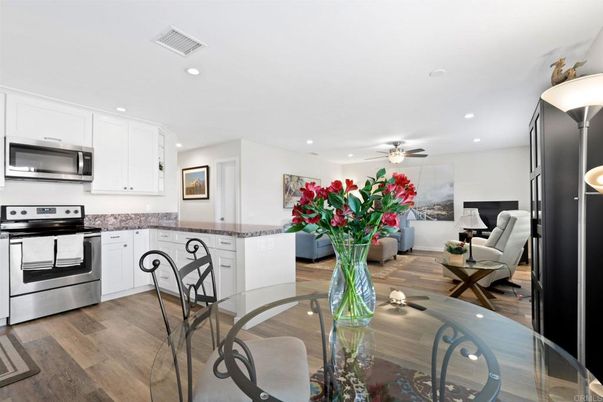 Dining room, Interior, Kitchen, Living room, Recessed Lighting, Stainless Steel Appliances, Wood Texture Flooring