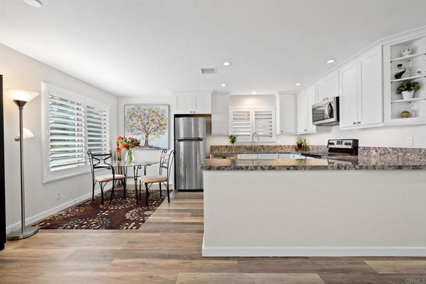 Dining room, Interior, Kitchen, Recessed Lighting, Stainless Steel Appliances, Wood Texture Flooring
