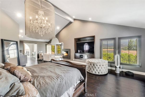 Bedroom, Chandelier, Fireplace, Interior, Recessed Lighting, Wood Texture Flooring