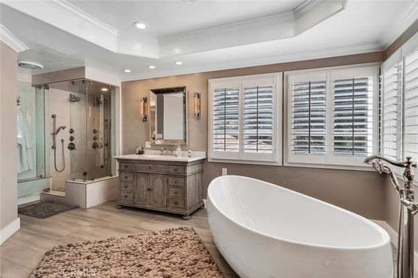 Bathroom, Dual Sink Vanities, Free Standing Baths, Glass Shower, Interior, Recessed Lighting, Wood Texture Flooring