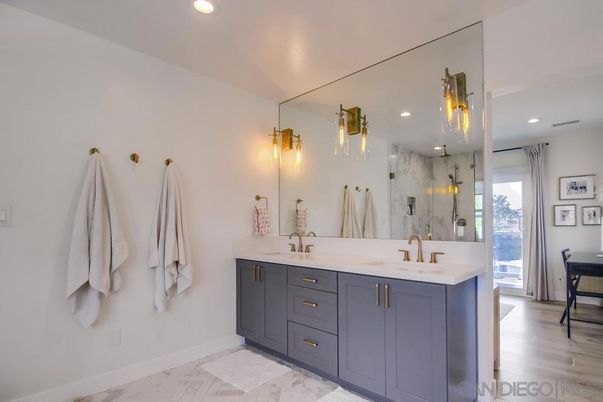 Bathroom, Dual Sink Vanities, Glass Shower, Interior, Marble, Recessed Lighting, Wood Texture Flooring