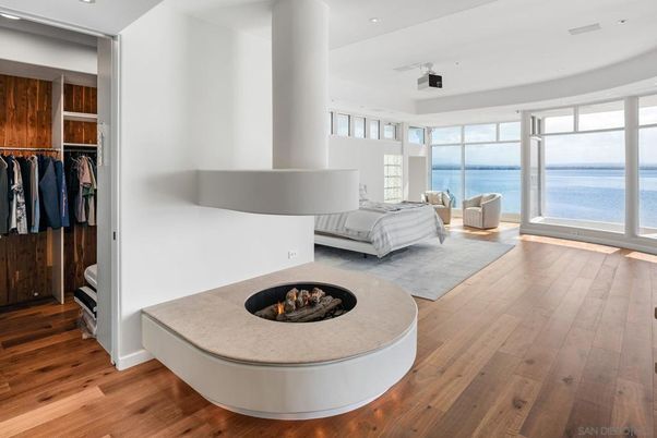 Bedroom, Fireplace, Interior, Recessed Lighting, Water, Wood Texture Flooring