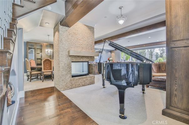 Dining room, Fireplace, Interior, Pendant Lights, Piano, Recessed Lighting, Stone Walls, Wood Texture Flooring