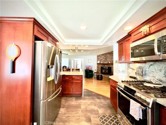 Fireplace, Interior, Kitchen, Living room, Recessed Lighting, Stainless Steel Appliances, Stone Walls, Wood Texture Flooring