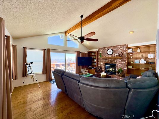 Fireplace, Interior, Living room, Recessed Lighting, Stone Walls, Wood Texture Flooring