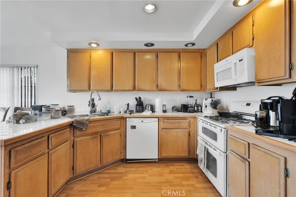 Interior, Kitchen, Recessed Lighting, Tile Countertops, Wood Texture Flooring