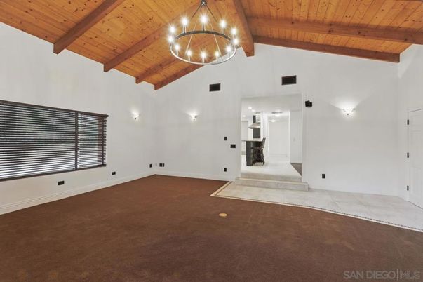 Empty room, Fireplace, Interior, Pendant Lights, Stone Walls, Wooden Beams, Wooden Ceilings
