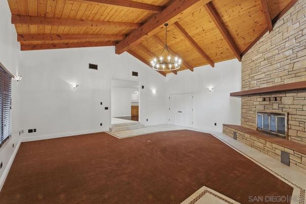Empty room, Fireplace, Interior, Pendant Lights, Stone Walls, Wooden Beams, Wooden Ceilings