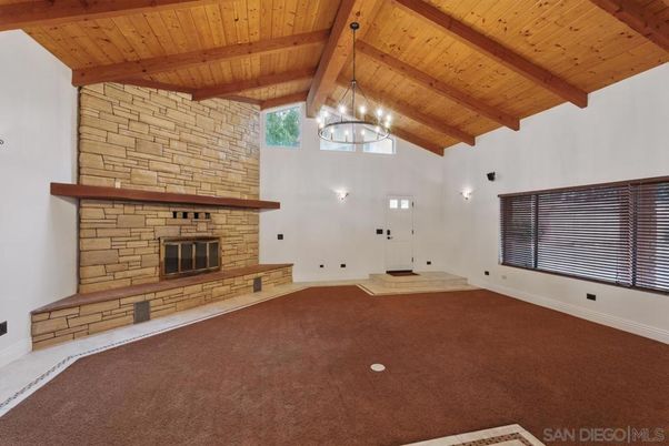 Empty room, Fireplace, Interior, Pendant Lights, Stone Walls, Wooden Beams, Wooden Ceilings