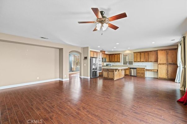 Empty room, Interior, Kitchen, Recessed Lighting, Stainless Steel Appliances, Wood Texture Flooring