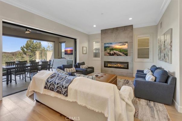 Dining room, Fireplace, Interior, Living room, Recessed Lighting, Wood Texture Flooring